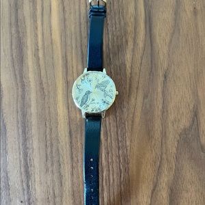 Olivia Burton black and gold watch with birds